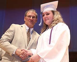 Board Member Don Newell presents Hailey Capobianco with her diploma during the Hubbard High School Commencement at Stambaugh Auditorium, Wednesday, May 24, 2017 in Youngstown.  ..(Nikos Frazier | The Vindicator)