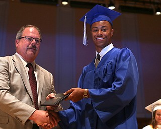 Board Member Marty Franko presents Sebastian Johnson with his diploma during the Hubbard High School Commencement at Stambaugh Auditorium, Wednesday, May 24, 2017 in Youngstown.  ..(Nikos Frazier | The Vindicator)