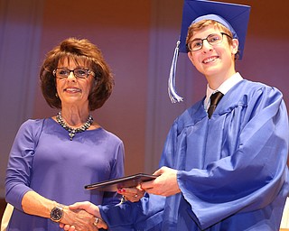 Board Member Linda Silvidi presents Macwell Torok with his diploma during the Hubbard High School Commencement at Stambaugh Auditorium, Wednesday, May 24, 2017 in Youngstown.  ..(Nikos Frazier | The Vindicator)