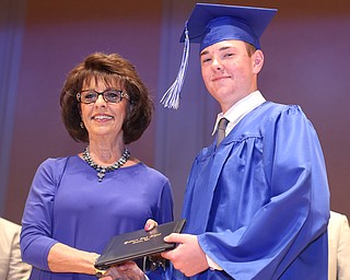 Board Member Linda Silvidi presents Mason Trinckes with his diploma during the Hubbard High School Commencement at Stambaugh Auditorium, Wednesday, May 24, 2017 in Youngstown.  ..(Nikos Frazier | The Vindicator)