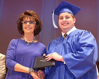 Board Member Linda Silvidi presents Codie Turcola with his diploma during the Hubbard High School Commencement at Stambaugh Auditorium, Wednesday, May 24, 2017 in Youngstown.  ..(Nikos Frazier | The Vindicator)
