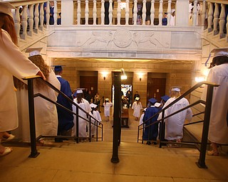 Hubbard high school graduates walk down the staircase after the Hubbard High School Commencement at Stambaugh Auditorium, Wednesday, May 24, 2017 in Youngstown.  ..(Nikos Frazier | The Vindicator)