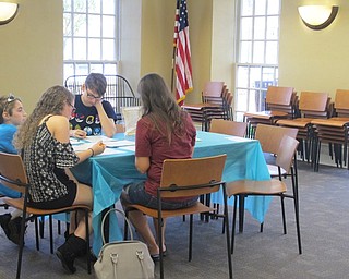 Neighbors | Alexis Bartolomucci.Guests at the William Shakespeare event at the Poland library on April 26 worked on solving a sonnet puzzle.