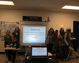 Neighbors | Alexis Bartolomucci.Poland High School Seminary students stood with the Mahoning County Educational Service Center students they raised money to buy a smartboard for.