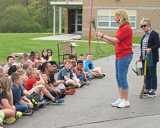 Neighbors | Alexis Bartolomucci.Joni Blase and Kristen Dailey explained how to plant and take care of their trees to the fourth-grade Robinwood students.