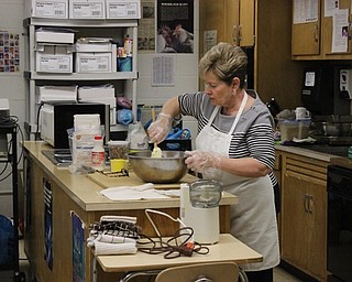 Neighbors | Abby Slanker.Margaret Stanko, a retired family and consumer science teacher, demonstrated how to make the dough for an Easter favorite, nut kolache, for Canfield High School students in Terri Dance’s Nutrition and Wellness class on April 11.
