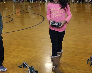 Neighbors | Abby Slanker.A C.H. Campbell Elementary School first-grade student tried her hand at a remote control robot at the school’s annual Career Day on May 12.