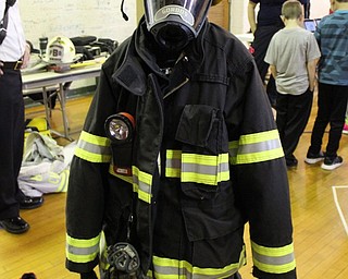 Neighbors | Abby Slanker.A C.H. Campbell Elementary School fourth-grade student tried on firefighter equipment during the school’s annual Career Day on May 12.