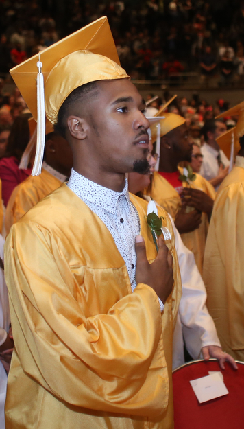 Alvin Salter Jr. places his hand on his chest during the national athem at the Warren G. Harding High School Commencement at W.D. Packard Music Hall, Thursday, May 25, 2017 in Warren.  ..(Nikos Frazier | The Vindicator)