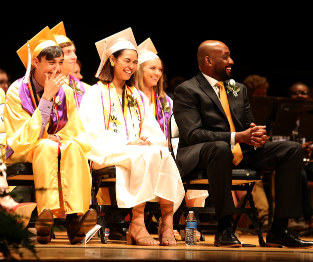 Da'Jahnae Provitt(center) and Constantine Payiavlas(left) laugh at Superintendent Chiaro's joke about Principal Dante  "Big Daddy" Capers(right) during the Warren G. Harding High School Commencement at W.D. Packard Music Hall, Thursday, May 25, 2017 in Warren.  ..(Nikos Frazier | The Vindicator)