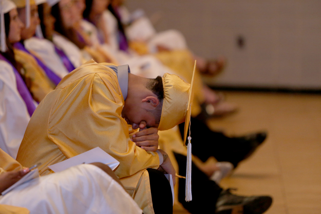 A student takes a rest during the valedictorian's address during the Warren G. Harding High School Commencement at W.D. Packard Music Hall, Thursday, May 25, 2017 in Warren.  ..(Nikos Frazier | The Vindicator)
