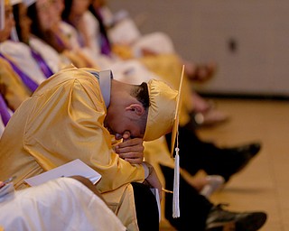 A student takes a rest during the valedictorian's address during the Warren G. Harding High School Commencement at W.D. Packard Music Hall, Thursday, May 25, 2017 in Warren.  ..(Nikos Frazier | The Vindicator)