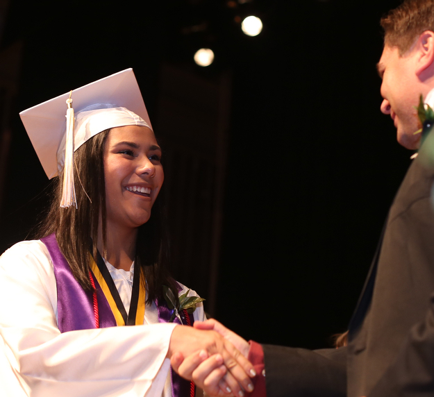 Isabella Van Kirk shakes Superintendent Steve Chiaro's hand after receiving her diploma during the Warren G. Harding High School Commencement at W.D. Packard Music Hall, Thursday, May 25, 2017 in Warren.  ..(Nikos Frazier | The Vindicator)