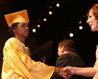Tay'Jhon Baugh shakes board member Patricia M. Limperos's hand after receiving his diploma during the Warren G. Harding High School Commencement at W.D. Packard Music Hall, Thursday, May 25, 2017 in Warren.  ..(Nikos Frazier | The Vindicator)