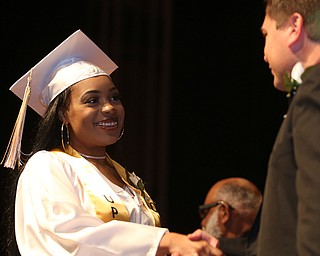Asa Craig shakes Superintendent Steve Chiaro's hand after receiving her diploma during the Warren G. Harding High School Commencement at W.D. Packard Music Hall, Thursday, May 25, 2017 in Warren.  ..(Nikos Frazier | The Vindicator)