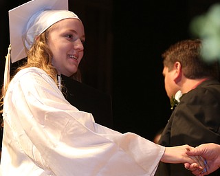 Jenna Elser shakes a board member's hand after receiving her diploma during the Warren G. Harding High School Commencement at W.D. Packard Music Hall, Thursday, May 25, 2017 in Warren.  ..(Nikos Frazier | The Vindicator)
