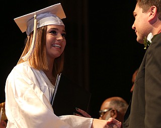 Brandie Fertig shakes Superintendent Steve Chiaro's hand after receiving her diploma during the Warren G. Harding High School Commencement at W.D. Packard Music Hall, Thursday, May 25, 2017 in Warren.  ..(Nikos Frazier | The Vindicator)