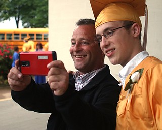 Jason Brock takes a selfie with his son Brandon after the Warren G. Harding High School Commencement at W.D. Packard Music Hall, Thursday, May 25, 2017 in Warren.  ..(Nikos Frazier | The Vindicator)