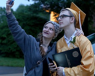 Sabrina Currence takes a selfie with her uncle, Russel Chaney after the Warren G. Harding High School Commencement at W.D. Packard Music Hall, Thursday, May 25, 2017 in Warren.  ..(Nikos Frazier | The Vindicator)
