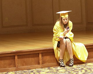        ROBERT K. YOSAY  | THE VINDICATOR..Liberty High School Graduation at Stambaugh Auditorium as the school graduated 78 students. Thursday evening.   .a moment alone before walking to get her diploma.