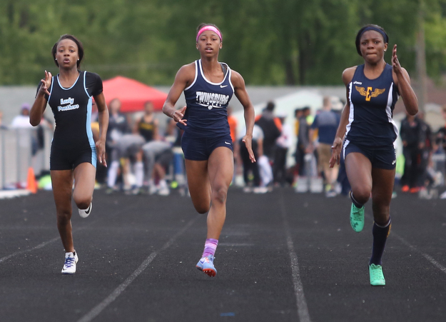 East's Jahniya Bowers(701)(Left) competes in the girls 100 meter dash final during the Division 1 Region 1 Track & Field Championships, Friday, May 26, 2017 at Austintown High School in Austintown...Twinsburg's Nya Bussey(614)(center) and Euclid's Caisja Chandler(119) run next to her...(Nikos Frazier | The Vindicator)..