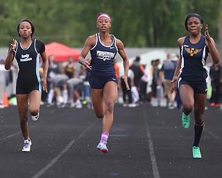 East's Jahniya Bowers(701)(Left) competes in the girls 100 meter dash final during the Division 1 Region 1 Track & Field Championships, Friday, May 26, 2017 at Austintown High School in Austintown...Twinsburg's Nya Bussey(614)(center) and Euclid's Caisja Chandler(119) run next to her...(Nikos Frazier | The Vindicator)..