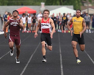 Warren Harding's Kayron Adams(180)(right) competes in the boys 100 meter dash final during the Division 1 Region 1 Track & Field Championships, Friday, May 26, 2017 at Austintown High School in Austintown...Running next to him are, Chardon's Joey Dinko(2)(center) and Maple Heights' Brandon Adams(671)...(Nikos Frazier | The Vindicator)..