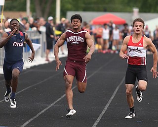 Austintown's Ralph Fitzgerald(128)(left) competes in the boys 100 meter dash final during the Division 1 Region 1 Track & Field Championships, Friday, May 26, 2017 at Austintown High School in Austintown...Running next to him are, Chardon's Joey Dinko(2)(center) and Maple Heights' Brandon Adams(671)...(Nikos Frazier | The Vindicator)..