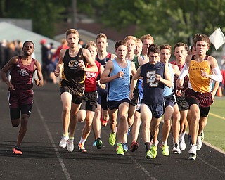 Boardman's Chris Butler(709)(left) competes in the boys 1600 meter run final during the Division 1 Region 1 Track & Field Championships, Friday, May 26, 2017 at Austintown High School in Austintown. The run was later reran...(Nikos Frazier | The Vindicator)..