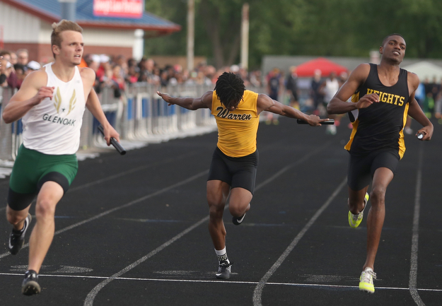 Warren Harding's Sterling Frazier(118)(center) competes in the boys 4x100 meter relay final during the Division 1 Region 1 Track & Field Championships, Friday, May 26, 2017 at Austintown High School in Austintown...Glenoak's Tate Rhoads(left) and Cleveland Height's Zaire Webb(right)..(Nikos Frazier | The Vindicator)..