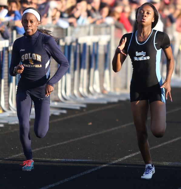 East's Jahniya Bowers(701)(right) competes in the girls 200 meter dash final during the Division 1 Region 1 Track & Field Championships, Friday, May 26, 2017 at Austintown High School in Austintown...Solon's Allison Vason(622)(left)..(Nikos Frazier | The Vindicator)..