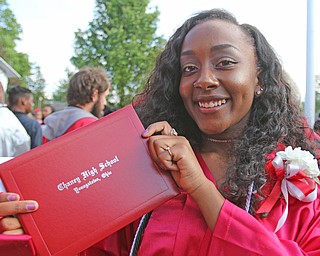        ROBERT K. YOSAY  | THE VINDICATOR..The last class of VPA/Stem Graduated at Chaney High School Friday afternoon ..Ò..Armoni Moore proudly displays her diploma...after the cereemony