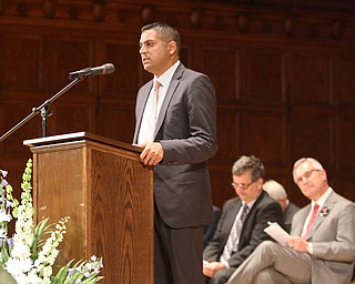        ROBERT K. YOSAY  | THE VINDICATOR..Pride emanated from the Stambaugh Auditorium Friday morning as 189 East High students celebrated their last hurrah of high school.- Jim Tressel main speaker.Ò..Krish Mohip  congratulate the graduates