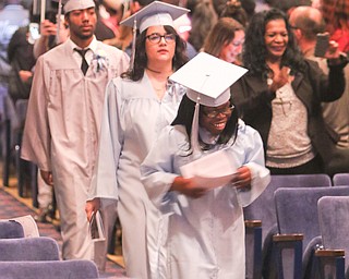        ROBERT K. YOSAY  | THE VINDICATOR..Pride emanated from the Stambaugh Auditorium Friday morning as 189 East High students celebrated their last hurrah of high school.- Jim Tressel main speaker.Ò..students enter the auditorium to receive their diplomas