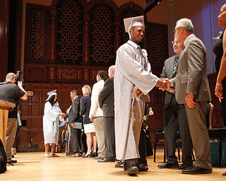        ROBERT K. YOSAY  | THE VINDICATOR..Pride emanated from the Stambaugh Auditorium Friday morning as 189 East High students celebrated their last hurrah of high school.- Jim Tressel main speaker.Ò..Graduates cross the stage...