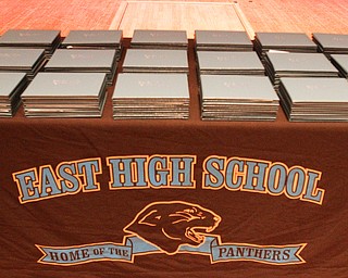        ROBERT K. YOSAY  | THE VINDICATOR..Pride emanated from the Stambaugh Auditorium Friday morning as 189 East High students celebrated their last hurrah of high school.- Jim Tressel main speaker.Ò.East High Diplomas "