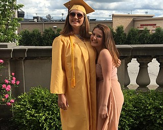 Daysha McConahy poses for a photo with her sister Shayna McConahy after Liberty High School's commencement.