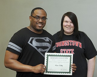 SPECIAL TO THE VINDICATOR
Two Youngstown State University students in Sister Jerome’s Mission College program recently received scholarships for the upcoming academic year. Kevin D. Talley, left, received the Bruce A. Roberts Memorial Scholarship, and Sarah L. Ludwick received the Karen R. Murphy Beatitude House Scholarship. Talley plans to graduate in December with a degree in social work. He served in the U.S. Navy for two years and plans to work with disadvantaged youths and adults. Ludwick also is majoring in social work and is projected to graduate next year. She is a graduate of Beatitude House and is interested in working with families. The students joined the program in August 2016. Sister Jerome’s Mission College is a program of Ursuline Sisters of Youngstown, and its mission is to break the cycle of poverty by helping students from low-income families succeed in college. In addition to providing mentors for students, the program offers financial assistance for food, clothing and transportation. For information call 330-746-6622.
