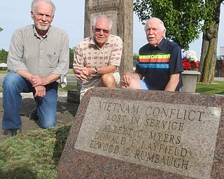 William D. Leiws the Vindicator Brothers from left of Don Layfield of Leavittsburg who was killed in 1970 in Viet Nam are Ron, John and Russell Layfield. They are pictured near a monument to war dead in Leavittsburg. Don's name is on the monument.