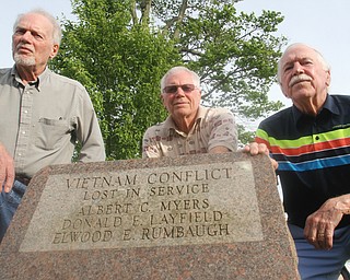 William D. Leiws the Vindicator Brothers from left of Don Layfield of Leavittsburg who was killed in 1970 in Viet Nam are Ron, John and Russell Layfield. They are pictured near a monument to war dead in Leavittsburg. Don's name is on the monument.