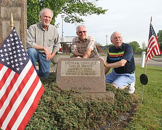 William D. Lewis | The Vindicator Brothers of Don Layfield of Leavittsburg, who was killed in 1970 in Vietnam are, from left, Ron, John and Russell Layfield. They are pictured near a monument to war dead in Leavittsburg. Don's name is on the monument.