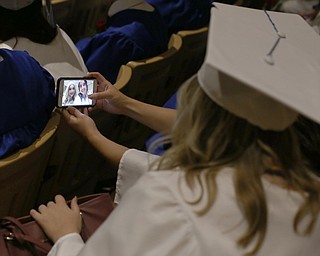 Marissa Vardavas(left) and Mary VanSuch take a selfie before the Poland Seminary High School Graduation, Saturday, May 27, 2017 in Poland...(Nikos Frazier | The Vindicator)