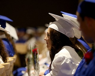 Sierra Ryzner listens to the roll call before the Poland Seminary High School Graduation, Saturday, May 27, 2017 in Poland...(Nikos Frazier | The Vindicator)