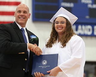 Stephanie Bass shakes board member James Lavorini's hand after receiving her diploma during the Poland Seminary High School Graduation, Saturday, May 27, 2017 in Poland...(Nikos Frazier | The Vindicator)