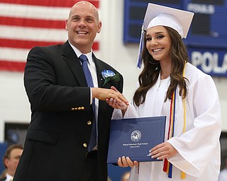 Rachel Boano shakes board member James Lavorini's hand after receiving her diploma during the Poland Seminary High School Graduation, Saturday, May 27, 2017 in Poland...(Nikos Frazier | The Vindicator)
