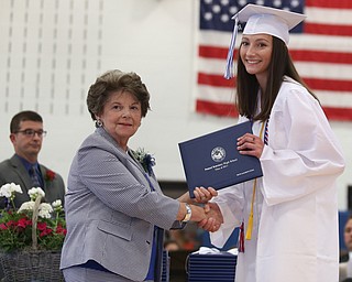 Devin Echle shakes board member Elinor Zedaker's hand after receiving her diploma during the Poland Seminary High School Graduation, Saturday, May 27, 2017 in Poland...(Nikos Frazier | The Vindicator)