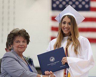 Amber Green shakes board member Elinor Zedaker's hand after receiving her diploma during the Poland Seminary High School Graduation, Saturday, May 27, 2017 in Poland...(Nikos Frazier | The Vindicator)