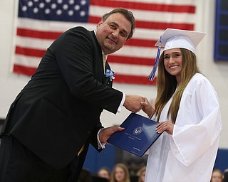 Gina Kubala shakes board member Larry Dinopoulos's hand after receiving her diploma during the Poland Seminary High School Graduation, Saturday, May 27, 2017 in Poland...(Nikos Frazier | The Vindicator)