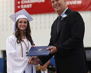 Kasey Valentini shakes board member Richard Weaver's hand after receiving her diploma during the Poland Seminary High School Graduation, Saturday, May 27, 2017 in Poland...(Nikos Frazier | The Vindicator)