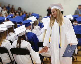 Amanda Wire high fives a classmate after receiving her diploma during the Poland Seminary High School Graduation, Saturday, May 27, 2017 in Poland...(Nikos Frazier | The Vindicator)